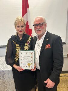 Adèle Poratto & husband Darrel Mullen with the King Charles the 111 Coronation Medal Award